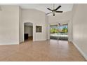 Bright living room with tile floors and sliding doors to pool at 8823 Wavyedge Ct, Trinity, FL 34655