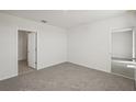 Spacious bedroom with carpeting and access to a bathroom at 120 Whiteland Bnd, Nokomis, FL 34275