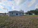 Spacious backyard with a large grassy area at 2840 S Biscayne Dr, North Port, FL 34287