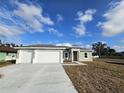 Newly built home features a three-car garage at 2840 S Biscayne Dr, North Port, FL 34287