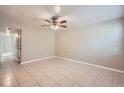 Spacious living room with tile floors and ceiling fan at 634 Newton S Ave, St Petersburg, FL 33701