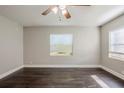 Spacious bedroom with dark hardwood floors and window blinds at 4675 20Th S Ave, St Petersburg, FL 33711