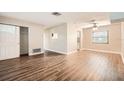 Spacious living room with wood-look flooring and lots of natural light at 6412 Skyline Ct, Spring Hill, FL 34606