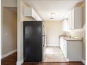 Renovated kitchen, featuring white cabinets and granite countertops at 6009 N 39Th St, Tampa, FL 33610