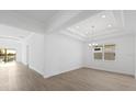 Elegant dining room with tray ceiling and access to the backyard at 1078 Signet Dr, Apollo Beach, FL 33572