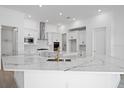 Spacious kitchen featuring white cabinets and a large island at 1078 Signet Dr, Apollo Beach, FL 33572
