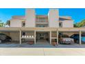 Condo building exterior showcasing covered parking and beach access at 524 Beach Rd # A, Sarasota, FL 34242