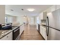 Modern kitchen with stainless steel appliances and granite countertops at 6256 Kimball Ct, Spring Hill, FL 34606