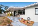 Inviting front porch with wooden posts and comfortable seating at 1344 Springdale St, Clearwater, FL 33755