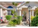 Front entrance with gate and lamp post at 818 Via Tripoli, Punta Gorda, FL 33950