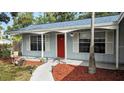 House exterior showcasing a red door and walkway at 152 Clemson Rd, Venice, FL 34293