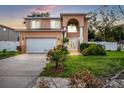 Two-story house with attached garage and landscaping at 8115 61St N St, Pinellas Park, FL 33781