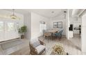 Bright dining room with a table for six and view to kitchen at 15392 Taurus Cir, Port Charlotte, FL 33981