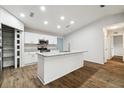 Modern kitchen featuring white shaker cabinets, granite countertops, and stainless steel appliances at 8540 Zane Ln, Port Richey, FL 34668