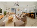 Bright living room features open floor plan with kitchen and dining area at 3105 46Th E St, Palmetto, FL 34221