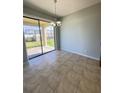 Bright dining area with sliding glass doors leading to the patio at 1403 Custer Bayou St, Ruskin, FL 33570