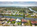 Community overview showcasing waterfront properties and lush landscaping at 72 Windsor Dr, Englewood, FL 34223