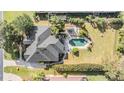 Aerial view showing house, pool, and backyard at 6437 Alcester Dr, New Port Richey, FL 34655