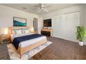 Main bedroom with wood flooring, large closet, and stylish decor at 3944 Nekoosa St, North Port, FL 34287