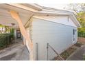 Side view of the house showing garage and fence at 4137 Glissade Dr, New Port Richey, FL 34652