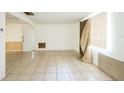 Empty living room with tiled floor and window at 4137 Glissade Dr, New Port Richey, FL 34652