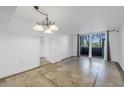 Bright dining room with tile floors and access to a balcony at 2333 Feather Sound Dr # A101, Clearwater, FL 33762