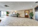 Building lobby with tile floors and elevator access at 2333 Feather Sound Dr # A101, Clearwater, FL 33762