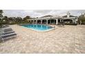 Community pool with plenty of lounge chairs at 2333 Feather Sound Dr # A101, Clearwater, FL 33762