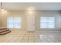Bright entryway with tile floors and neutral walls at 7707 N Riverdale Ave, Tampa, FL 33604