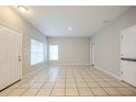 Spacious living room featuring tile floors at 7707 N Riverdale Ave, Tampa, FL 33604