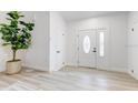 Bright entryway with white door and modern flooring at 5116 11Th W Ave, Bradenton, FL 34209