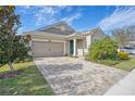 One story home with a two-car garage and paver driveway at 11223 Spring Gate Trl, Bradenton, FL 34211