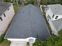 An overhead view of the home's roof and the neighborhood at 4311 Rustic Pine Pl, Wesley Chapel, FL 33544