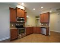 Kitchen with granite countertops and wood cabinets at 4311 Rustic Pine Pl, Wesley Chapel, FL 33544