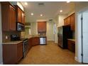 Spacious kitchen with granite countertops and stainless steel appliances at 4311 Rustic Pine Pl, Wesley Chapel, FL 33544