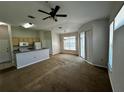 Living room, open concept with kitchen and dining area at 5707 Legacy Crescent Pl # 303, Riverview, FL 33578