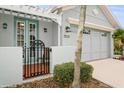 Front entrance with double doors and a decorative gate at 7313 Emma Rd, Bradenton, FL 34209