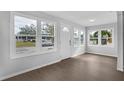 Bright and airy living room with hardwood floors and large windows at 1502 10Th W St, Bradenton, FL 34205