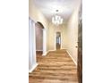 Bright entryway with hardwood floors and columns at 2105 Vickery Ln, Dover, FL 33527