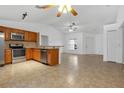 Open floor plan showing kitchen with island and living area at 4944 Alseir Rd, North Port, FL 34288