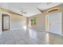 Bright living room with tile floors and vaulted ceilings at 7864 Jayman Rd, North Port, FL 34291