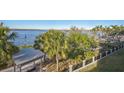 Scenic waterfront view with lush greenery and a gazebo at 210 3Rd W St # 8205, Bradenton, FL 34205