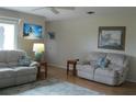 Bright living room with two sofas and hardwood floors at 1000 Osceola Blvd, Englewood, FL 34223