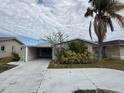 Charming single story home with carport and mature landscaping at 4113 Floramar Ter, New Port Richey, FL 34652