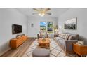 Bright living room featuring hardwood floors and comfy seating at 2044 27Th W Ave, Bradenton, FL 34205