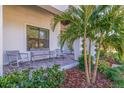 Relaxing front porch with rocking chairs and lush landscaping at 988 47Th N Ave, St Petersburg, FL 33703