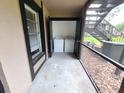 Stackable washer and dryer in screened porch at 4034 Dream Oak Pl # 104, Tampa, FL 33613