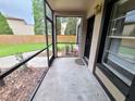 Screened porch with access to backyard at 4034 Dream Oak Pl # 104, Tampa, FL 33613