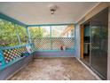 Empty screened porch with painted walls and concrete floor at 4119 Beacon Square Dr, Holiday, FL 34691