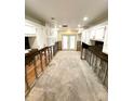 Kitchen undergoing renovation with new white cabinets at 514 Boca Ciega Point N Blvd, St Petersburg, FL 33708